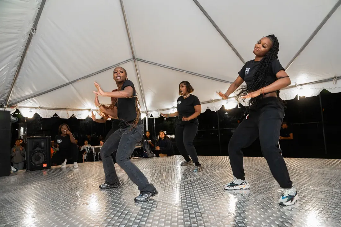 People dancing on stage.